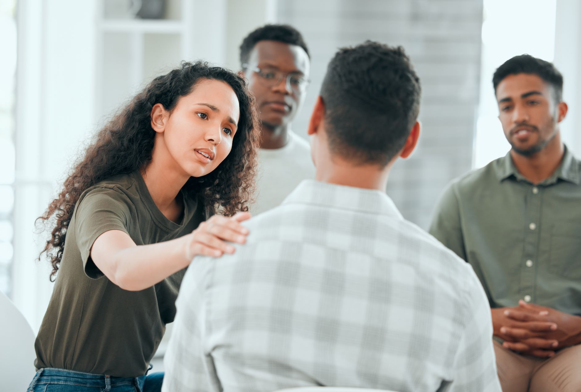 A leader facilitating a conflict resolution meeting with team members